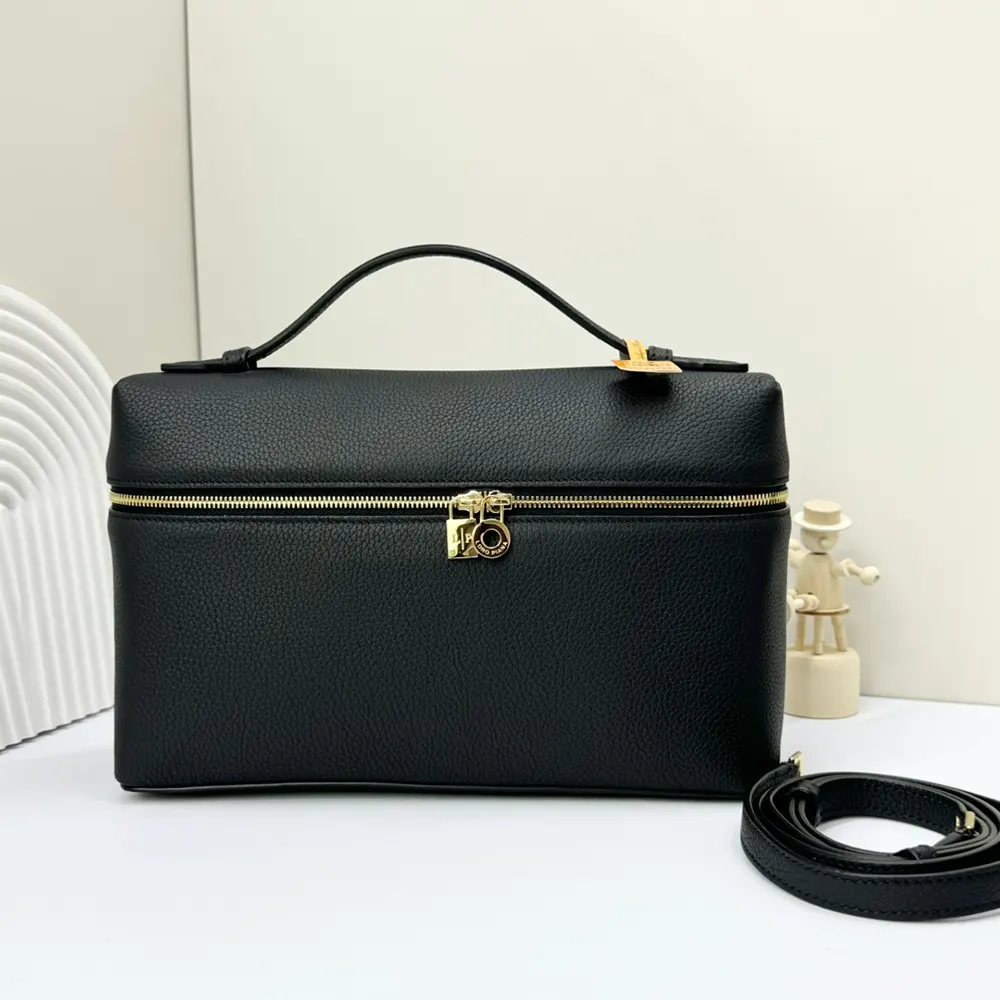 Close-up of smooth black leather and silver hardware detail