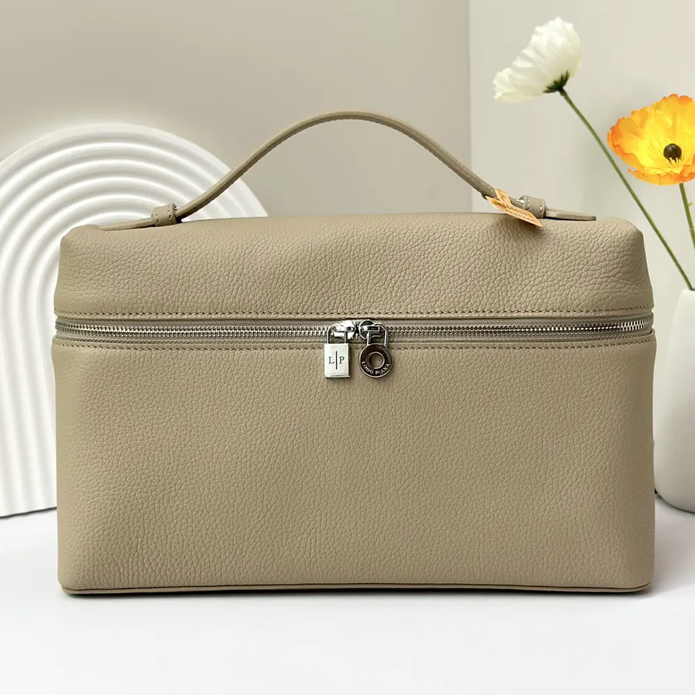 Close-up of gray leather texture and silver hardware on Loro Piana bag
