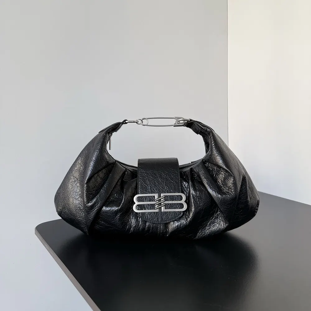 Side angle showing structured silhouette of Balenciaga Women Pamela Shoulder Bag Medium