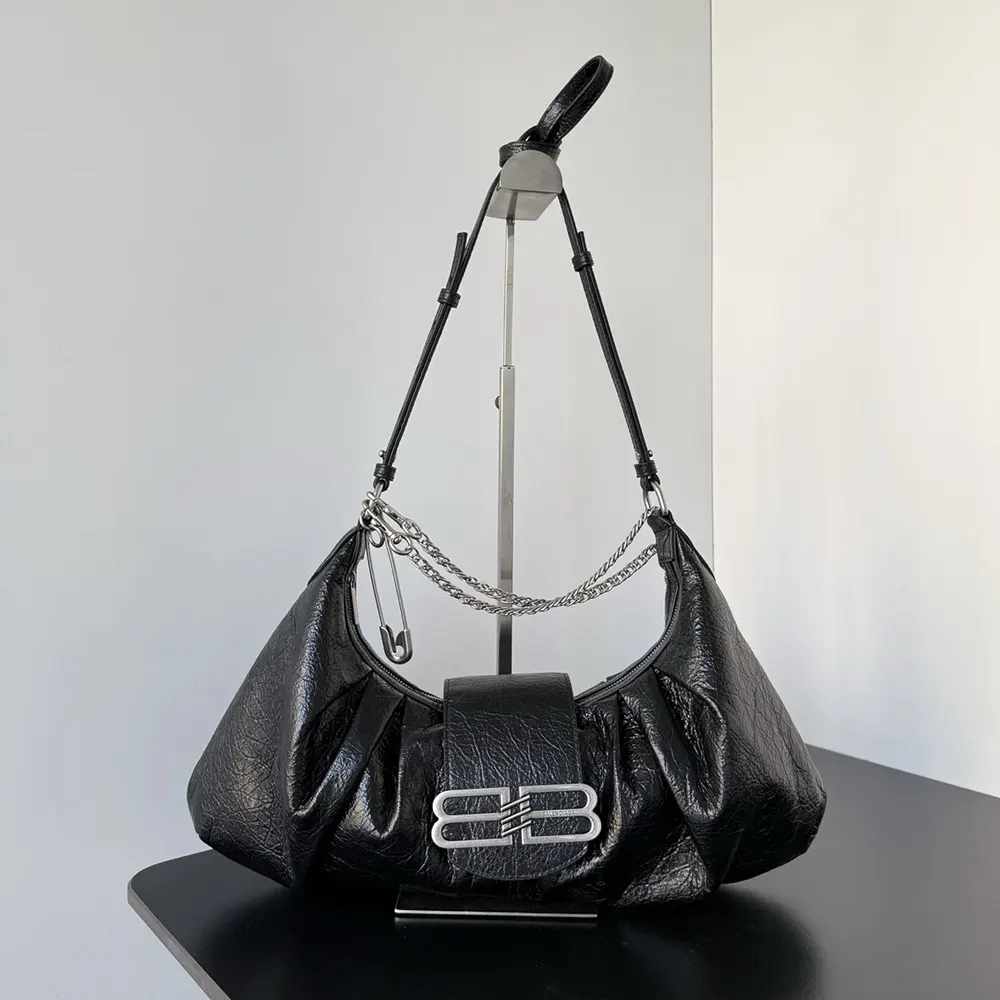 Close-up of matte black buckle and arena lambskin texture on Balenciaga bag