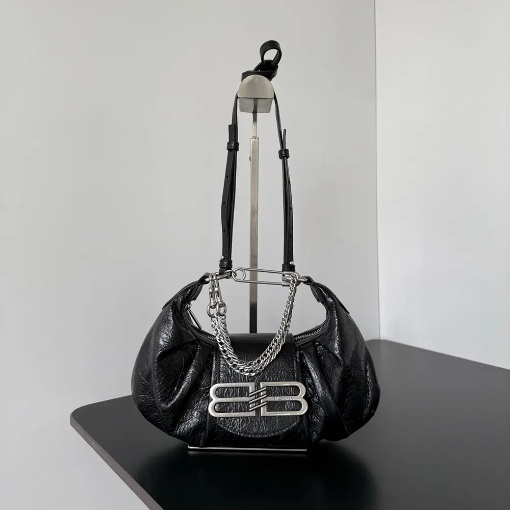 Side profile showcasing compact silhouette of Balenciaga Women Pamela Shoulder Bag Small