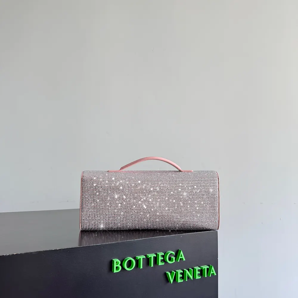 Side angle showing slim silhouette of Bottega Veneta Women Andiamo Clutch-Rose