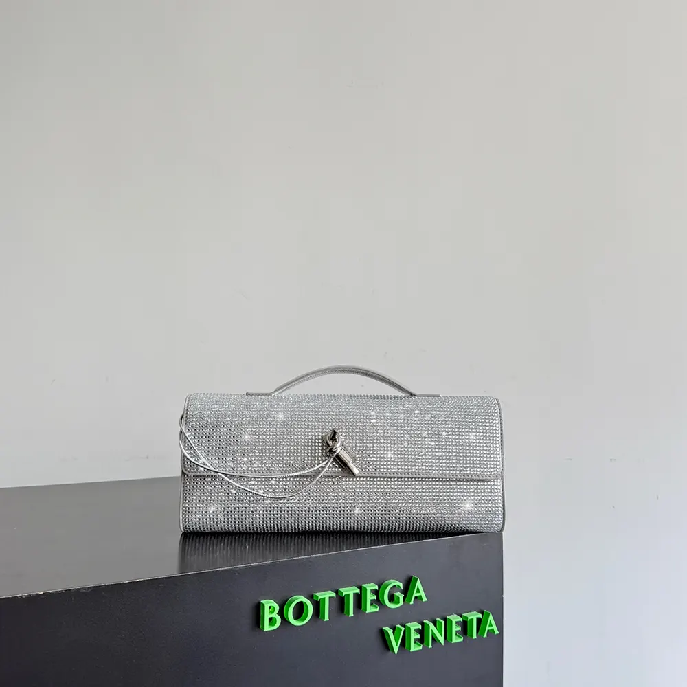 Close-up of silver-tone hardware on Bottega Veneta Women Andiamo Clutch-Silver