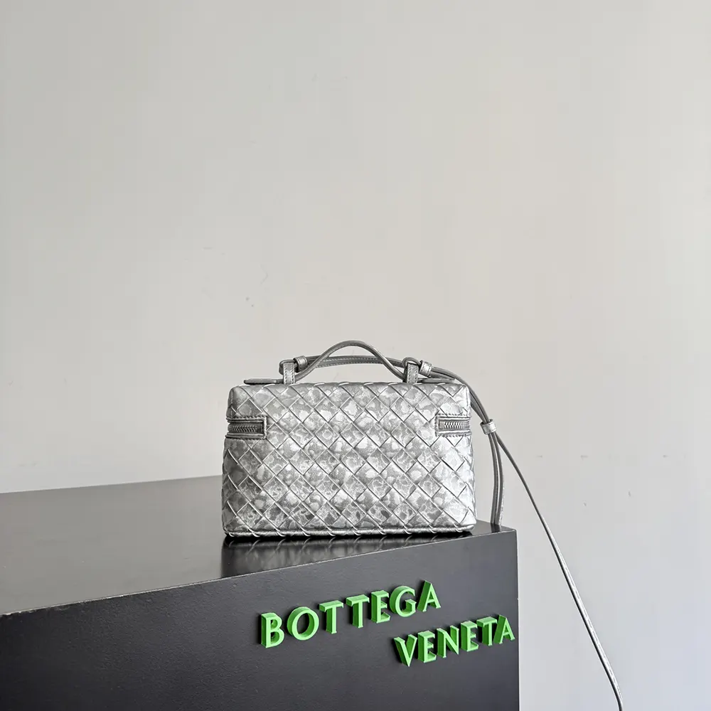 Side angle showing compact silhouette and zip closure on bag