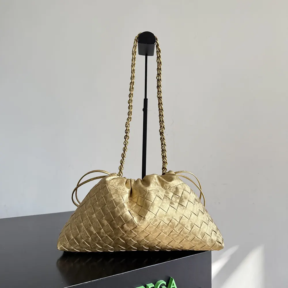 Side angle of Bottega Veneta Women Dustbag Notte-Gold shoulder bag with strap