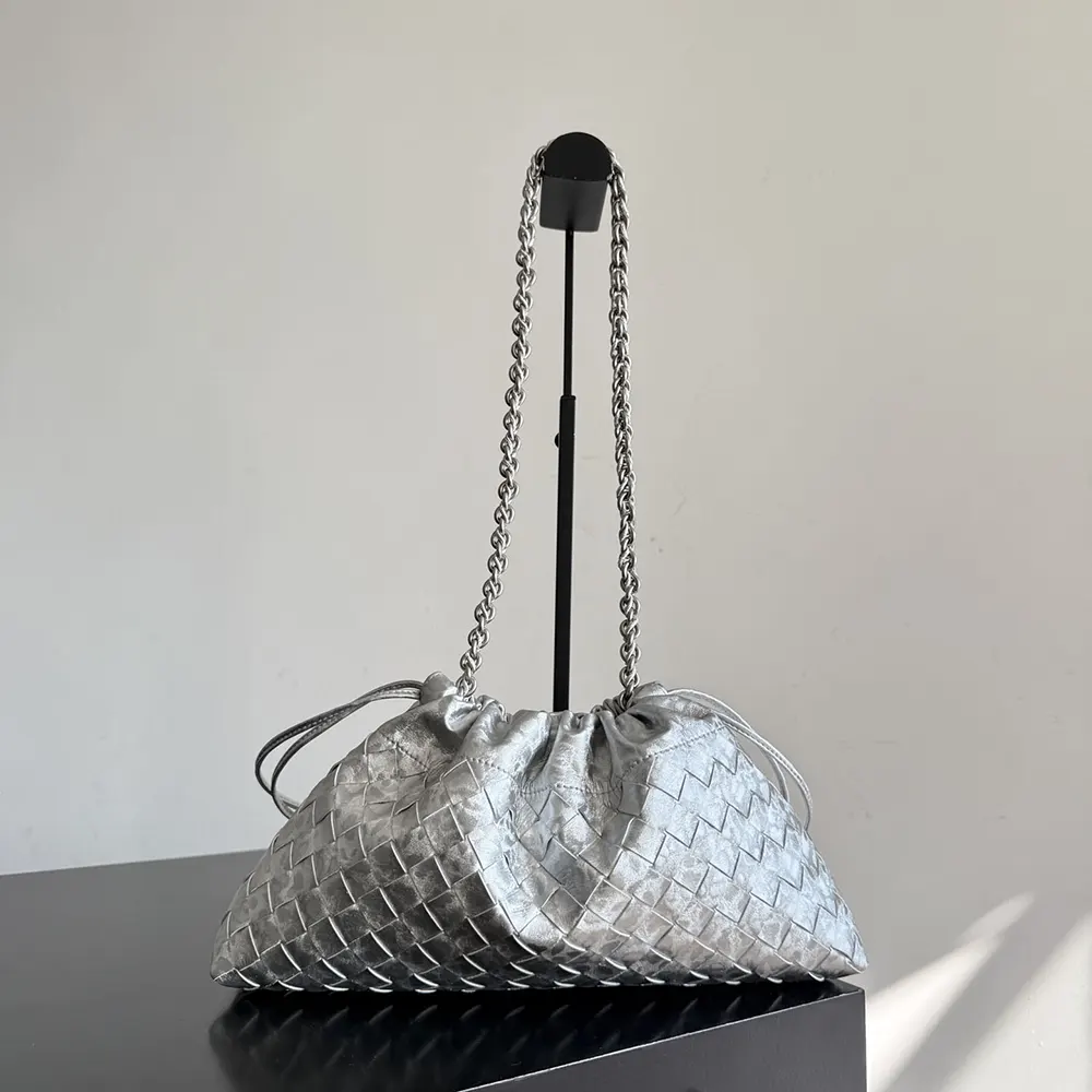 Side angle showing adjustable strap and silver hardware of Dustbag Notte-Silver