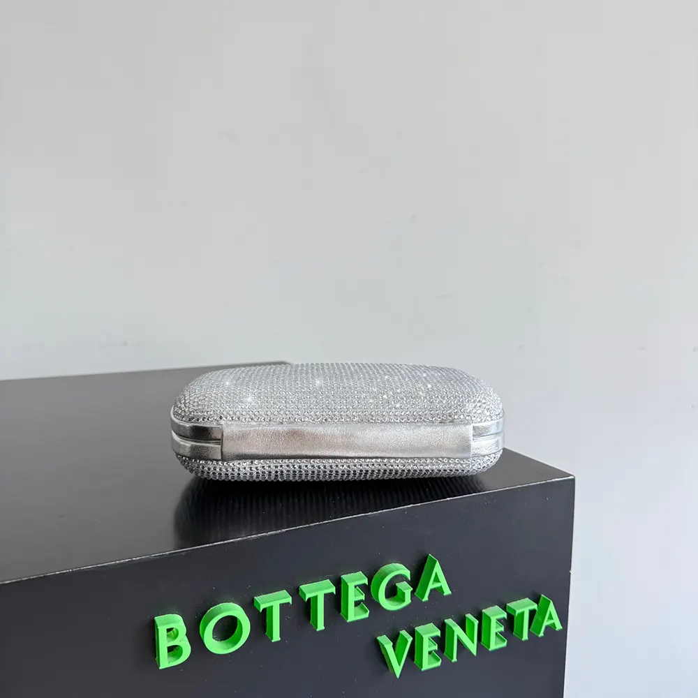 Side profile showing compact silhouette of Bottega Veneta Women Knot-Silver handbag