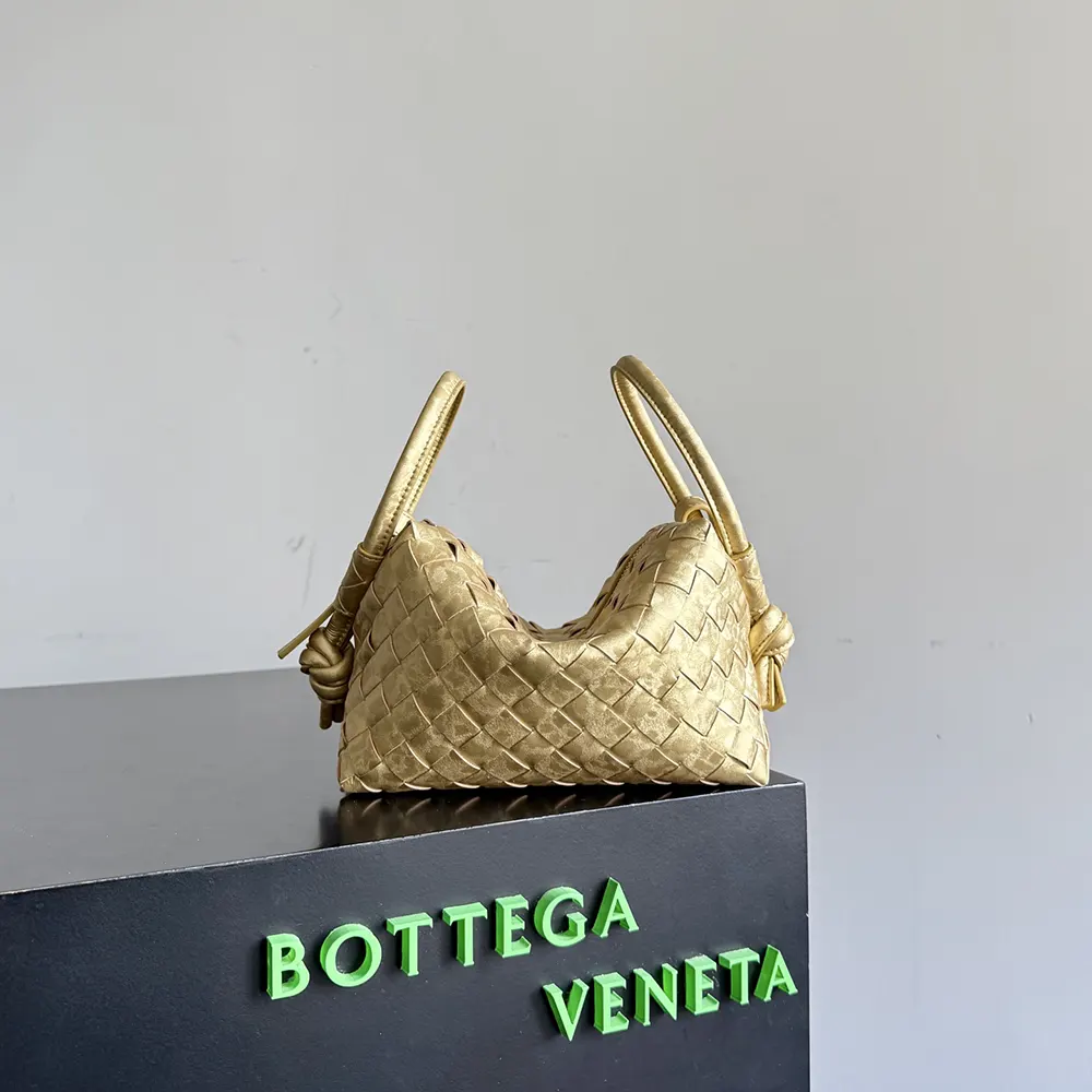 Close-up of gold-tone hardware on Bottega Veneta Women Loop Top Handle-Gold