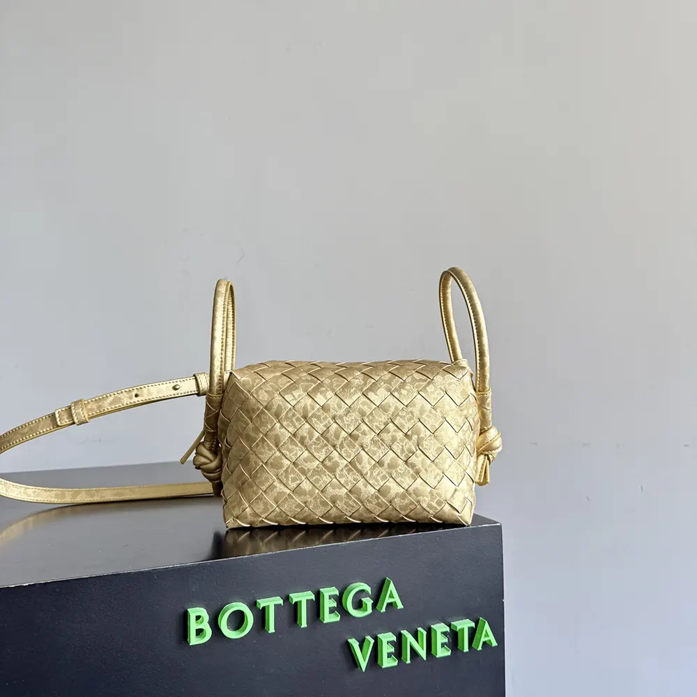 Side profile of Bottega Veneta Women Loop Top Handle-Gold highlighting silhouette