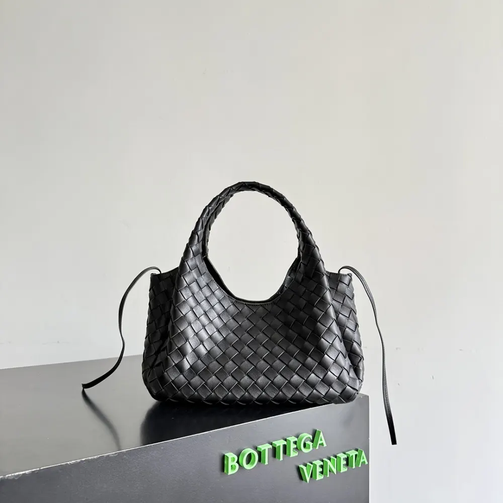 Side angle of Bottega Veneta Women Small Campana-Black highlighting compact silhouette