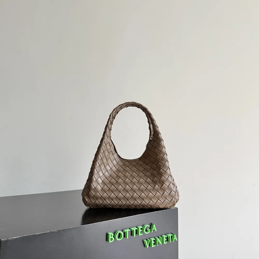 Close-up of chocolate intrecciato leather detail on Bottega Veneta bag