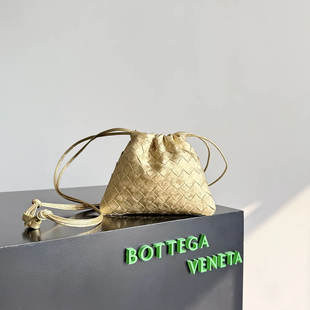 Close-up of Bottega Veneta Women Small Dustbag-Gold gold sheen and closure detail