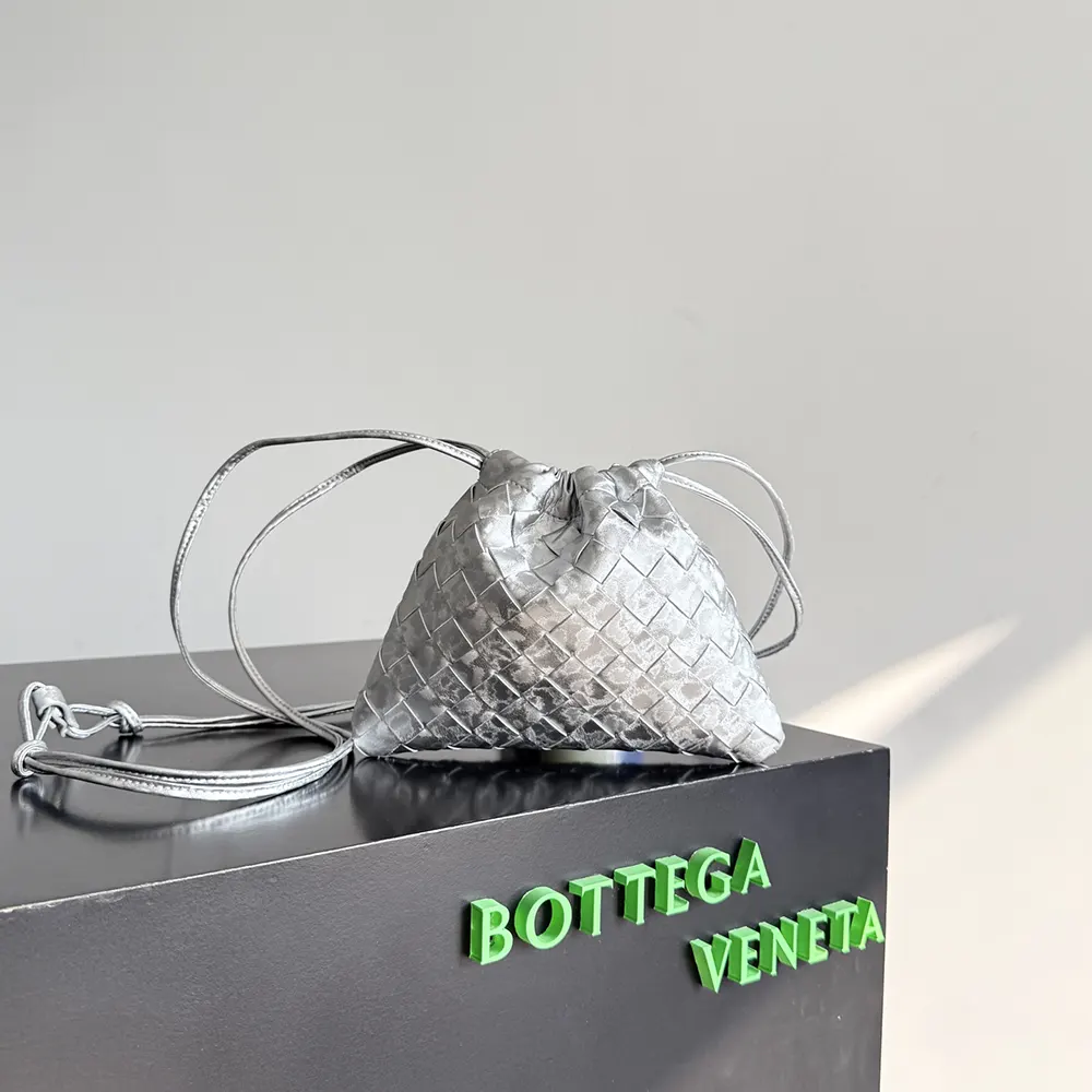 Close-up detail of silver fabric texture on Bottega Veneta Small Dustbag