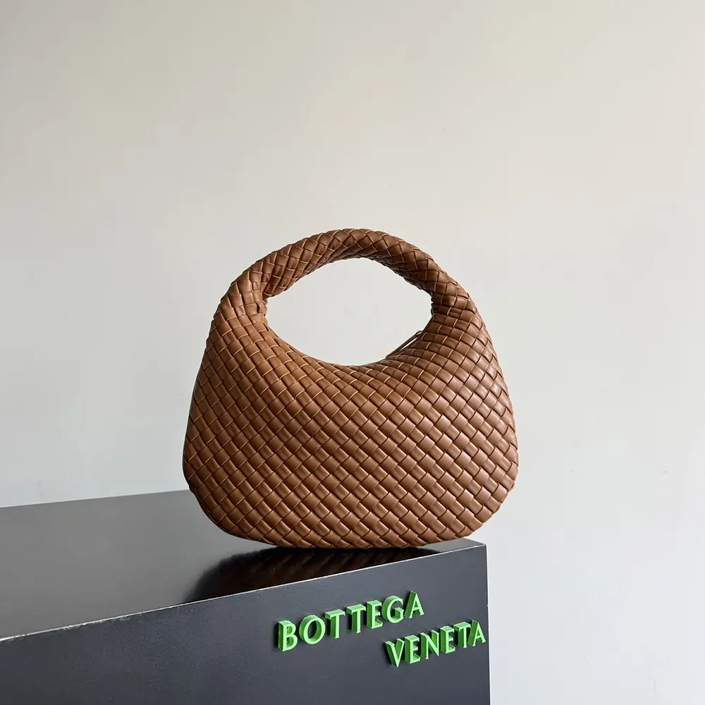 Close-up of intrecciato weave detail on Bottega Veneta Women Small Veneta-Brown
