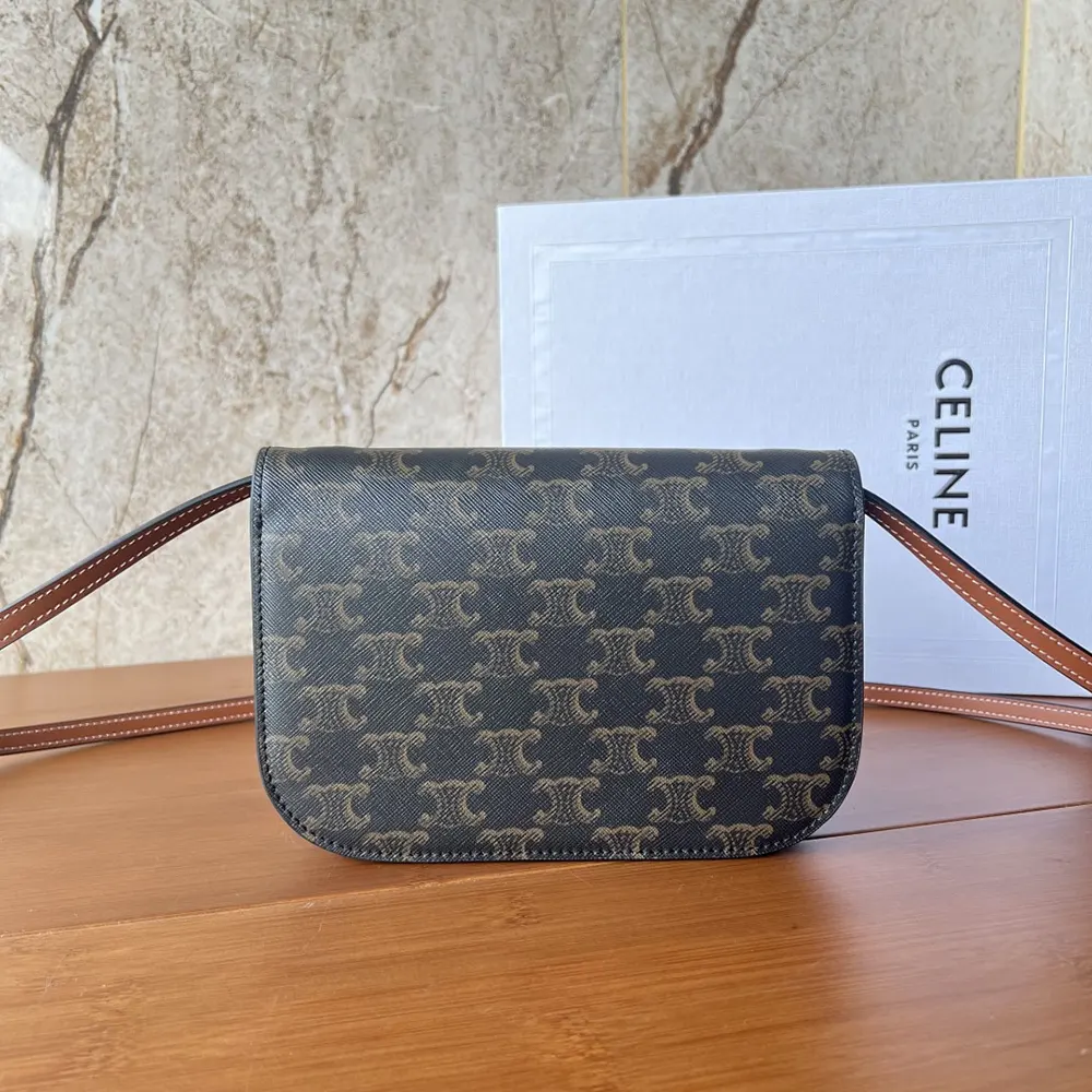 Side profile showing adjustable strap and calfskin detail of Celine wallet