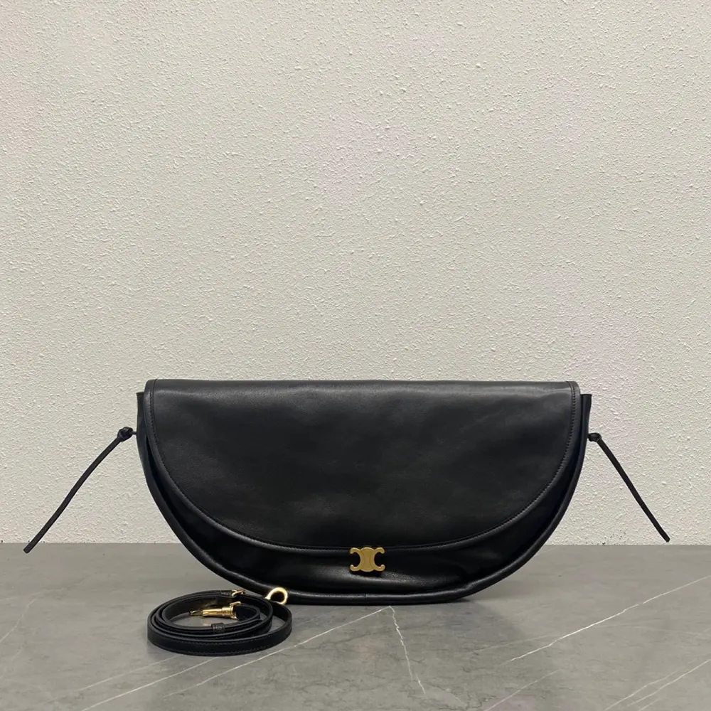 Close-up of signature Triomphe clasp on Celine Women Halfmoon Soft Triomphe Bag