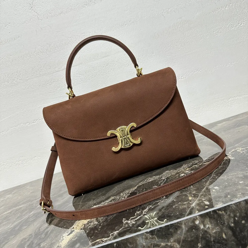 Close-up of gold-tone hardware on Celine Women Medium Nino Bag