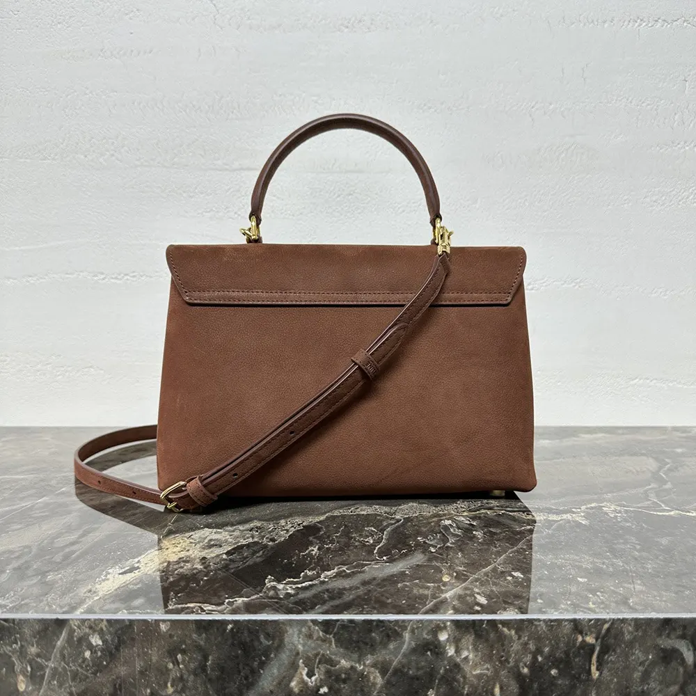 Side angle showing shoulder strap and silhouette of Celine Women Medium Nino Bag