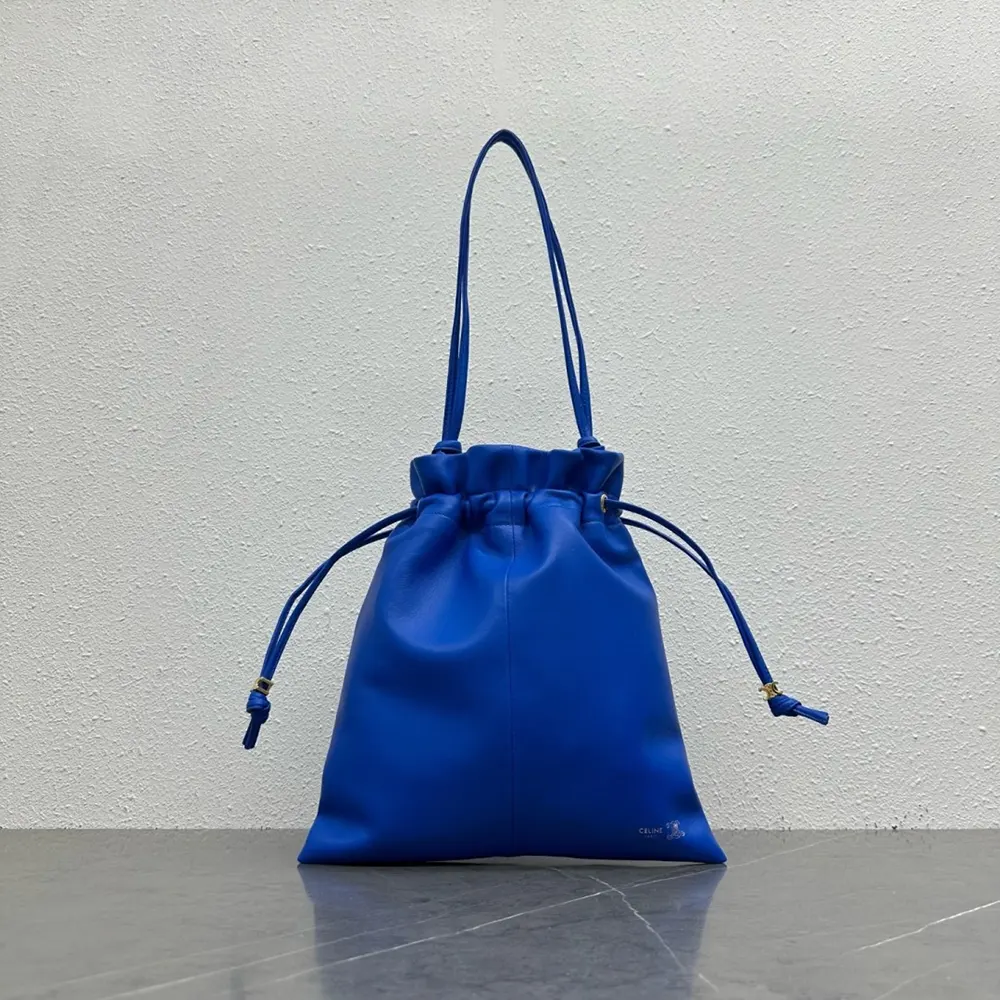 Side angle showing compact silhouette of Celine Women Small Crystal Pouch