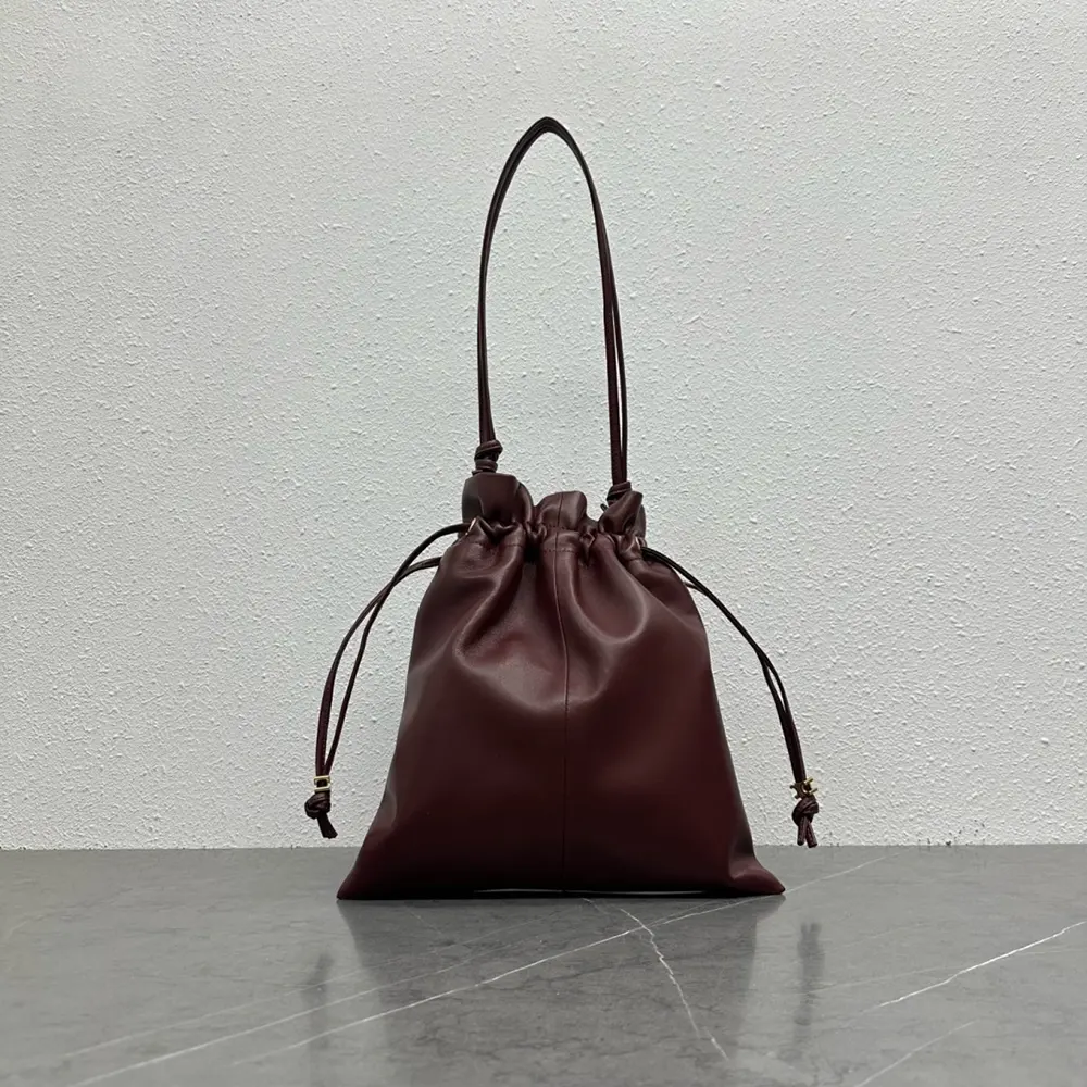 Side angle showing silver-tone hardware on Celine Small Crystal Pouch