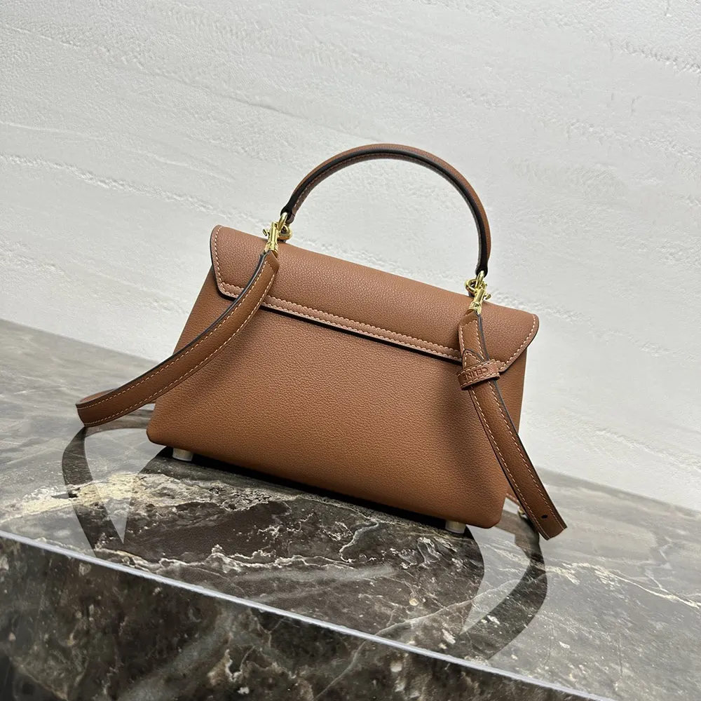 Side angle showing compact silhouette of Celine Women Teen Nino Bag