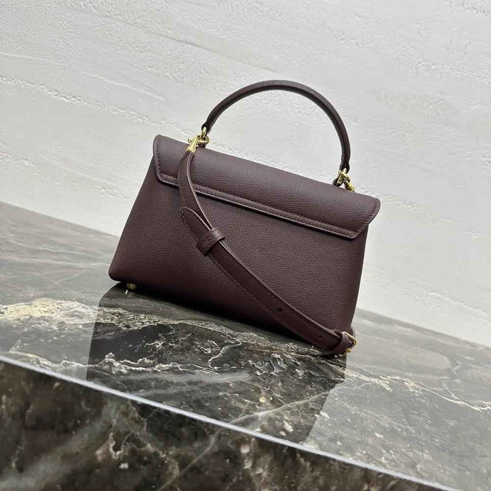 Side angle showing slim silhouette and adjustable shoulder strap