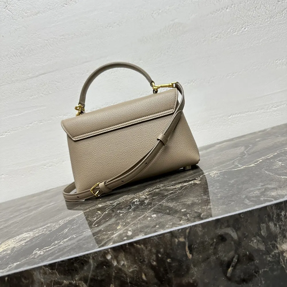 Side profile showing adjustable shoulder strap of Celine Women Teen Nino Bag