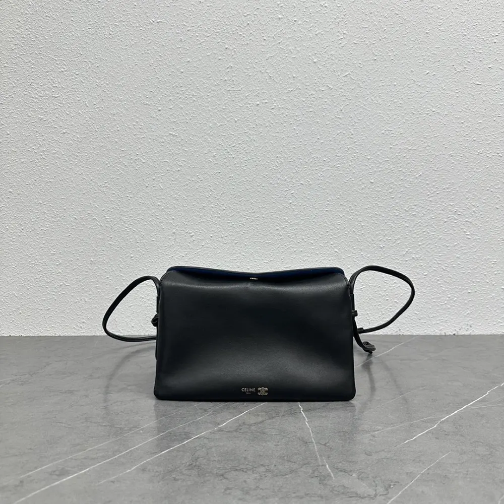 Close-up of gold-tone hardware on Celine Women Trio Flap bag