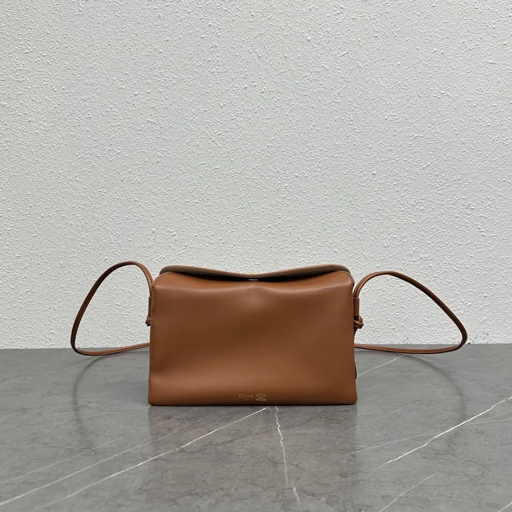Close-up of gold hardware and triple-flap detail on Celine Women Trio Flap bag