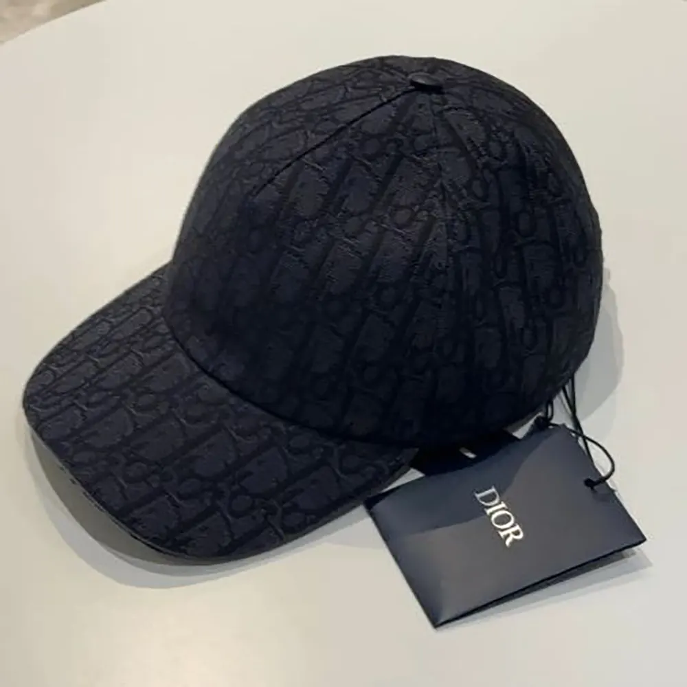 Close-up detail of Dior Unisex Oblique Cap’s signature jacquard fabric texture