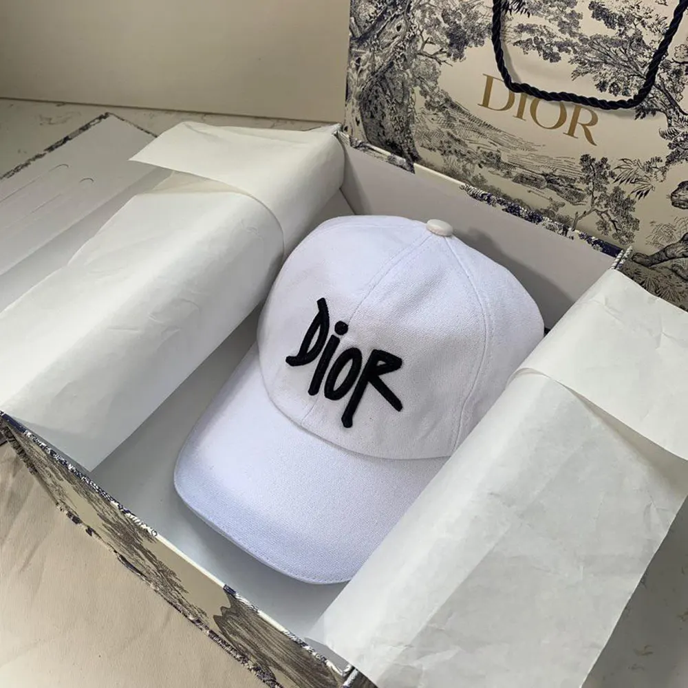 Close-up on embroidered logo on Dior Unisex Stussy Embroidered Logo Hat