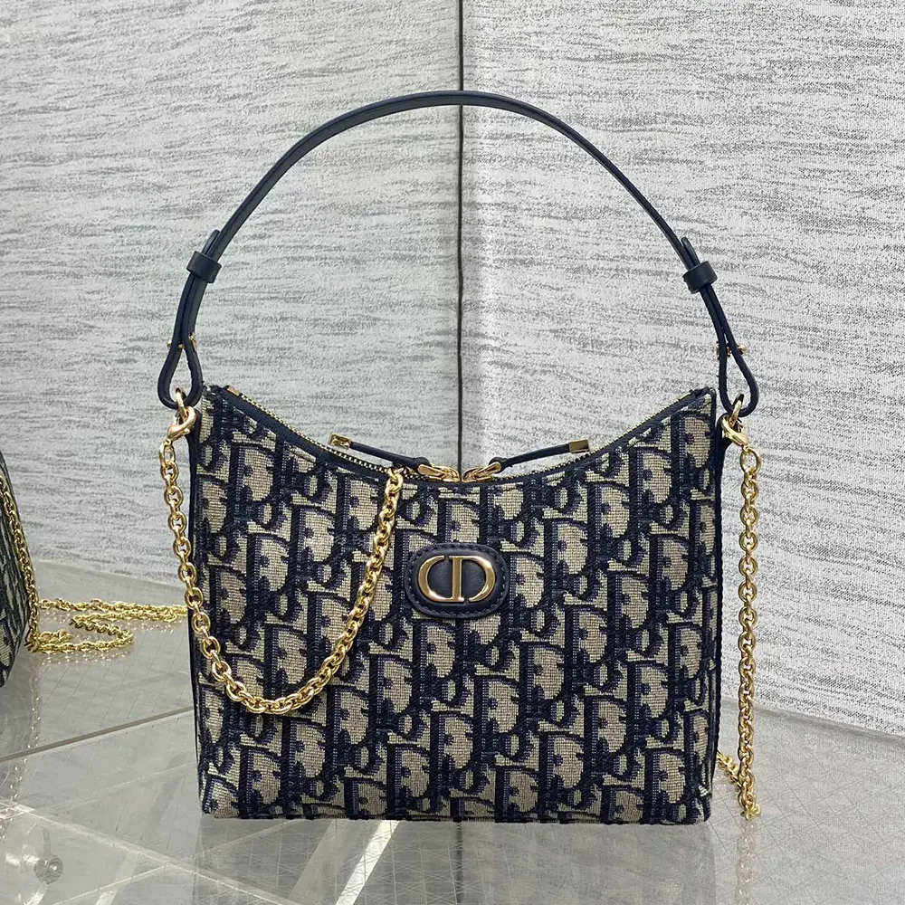 Side profile showing sleek silhouette of Dior Women 30 Montaigne Diorling Mini Bag Blue Dior Oblique