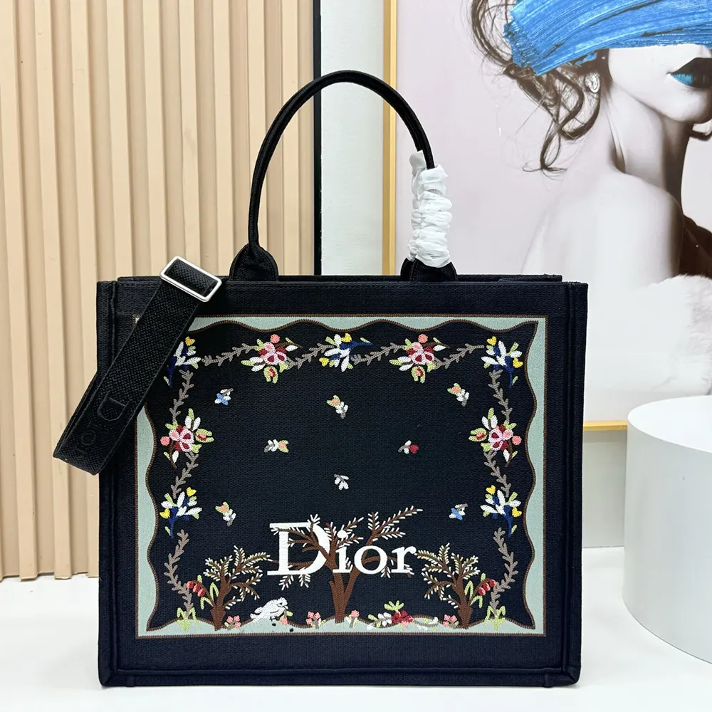 Close-up of multicolor Revolution Flowers embroidery on black Dior tote