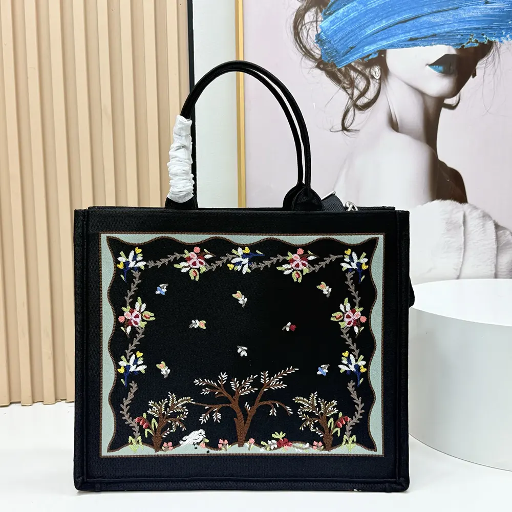 Side angle showing strap and silver-tone hardware of Dioramour medium tote
