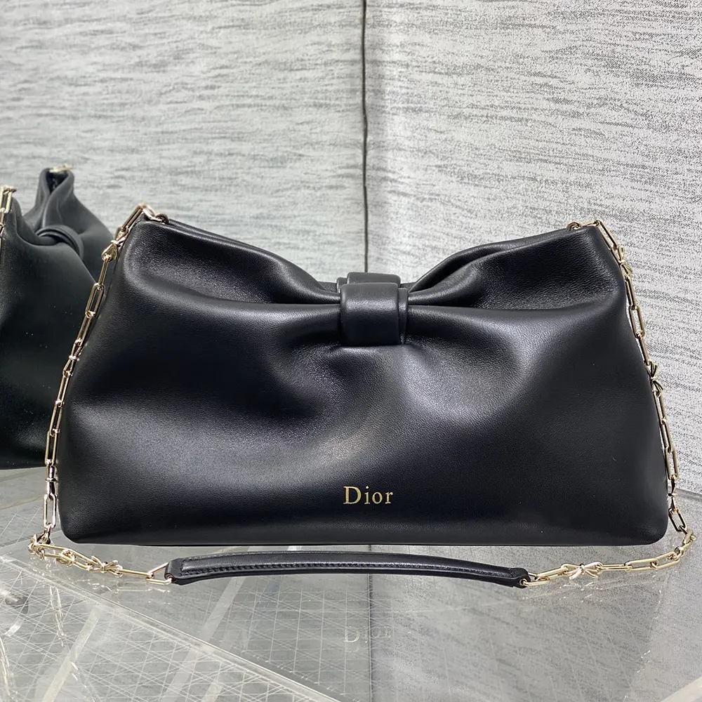Side angle showing adjustable shoulder strap on Dior Women Medium Dior Bow Bag