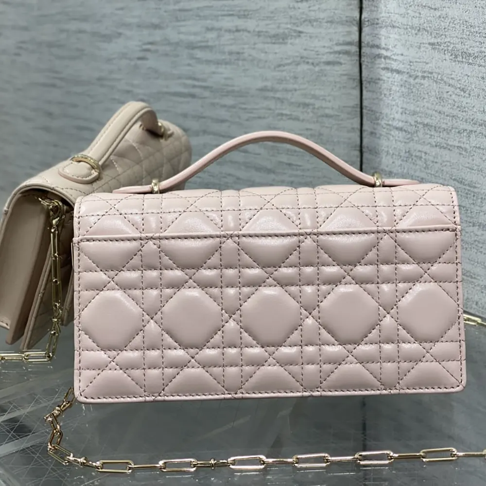 Side angle showing flap and silver hardware on Dior Women My Dior Mini Bag