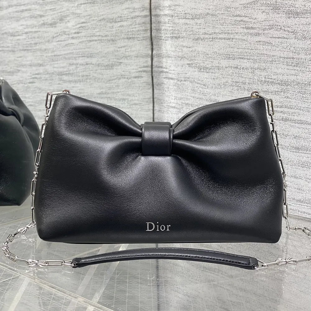 Close-up of black lambskin and silver hardware on Small Dior Bow Bag