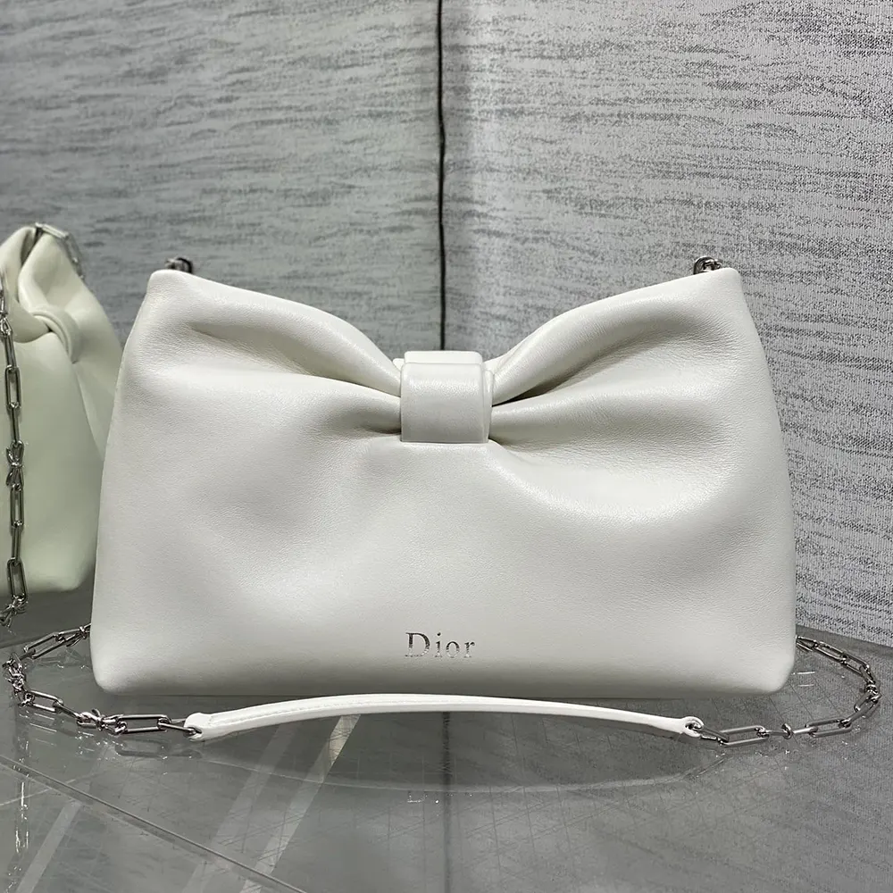 Close-up of silver hardware and white lambskin leather texture on Dior bag