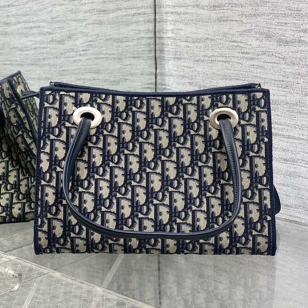 Side angle showing adjustable strap on Dior Women Small Shopping Bag