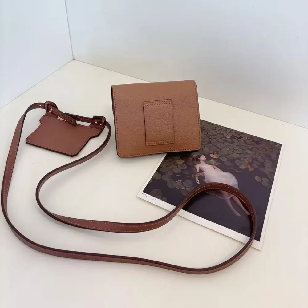 Side angle highlighting slim profile of Hermes Women Roulis Slim Wallet-Brown