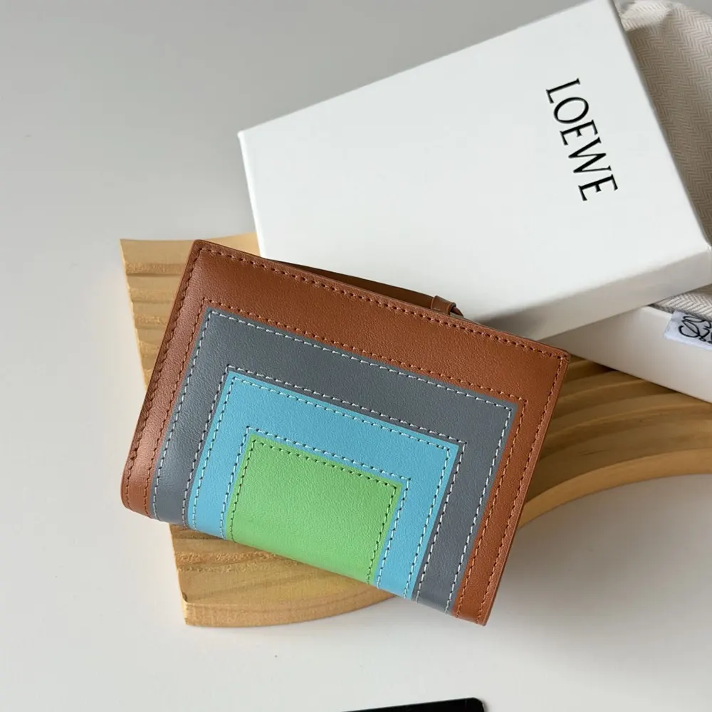 Side angle showing slim profile of Loewe Unisex Compact Wallet