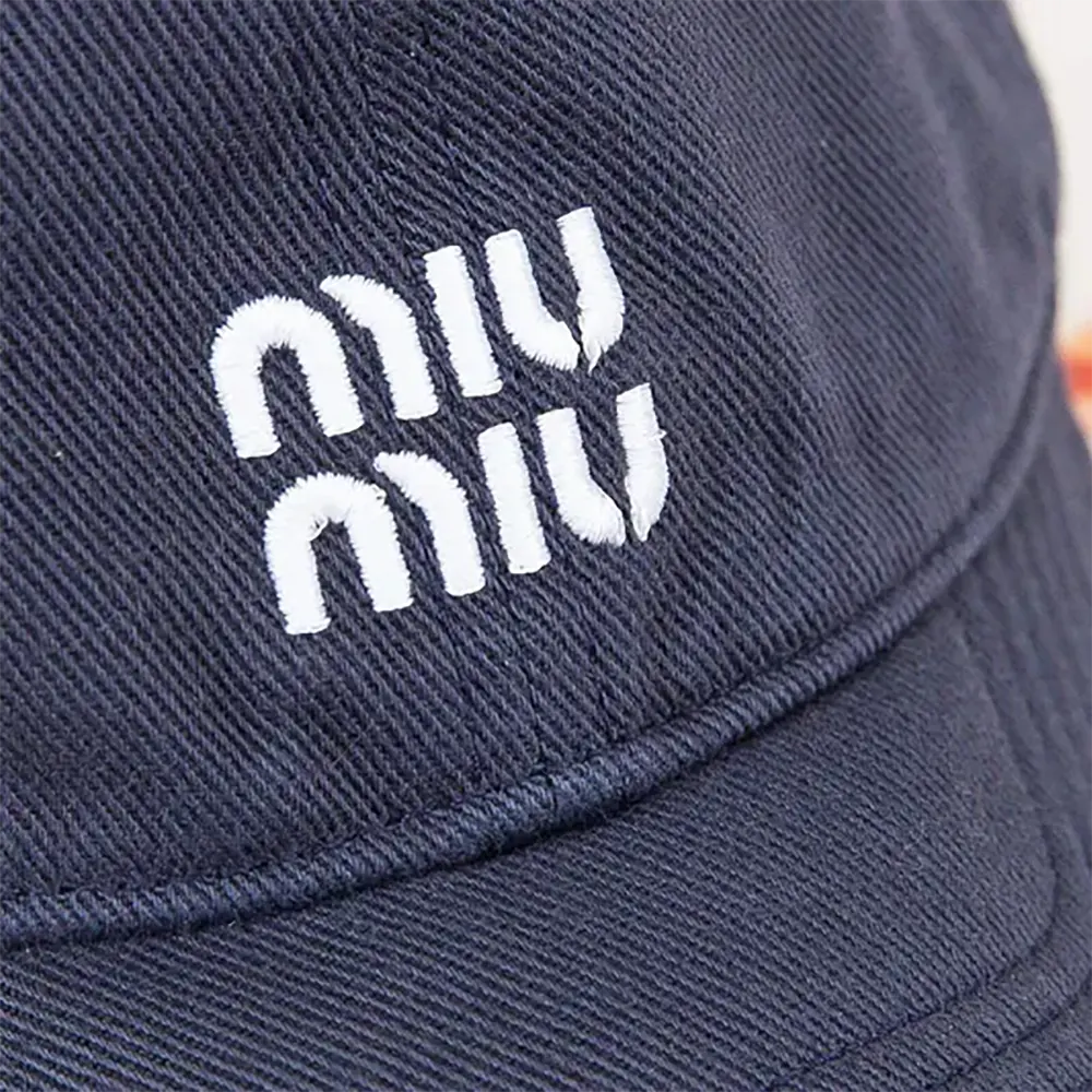 Side profile showing adjustable strap on Miu Miu Women Denim Baseball Cap-Blue/Red