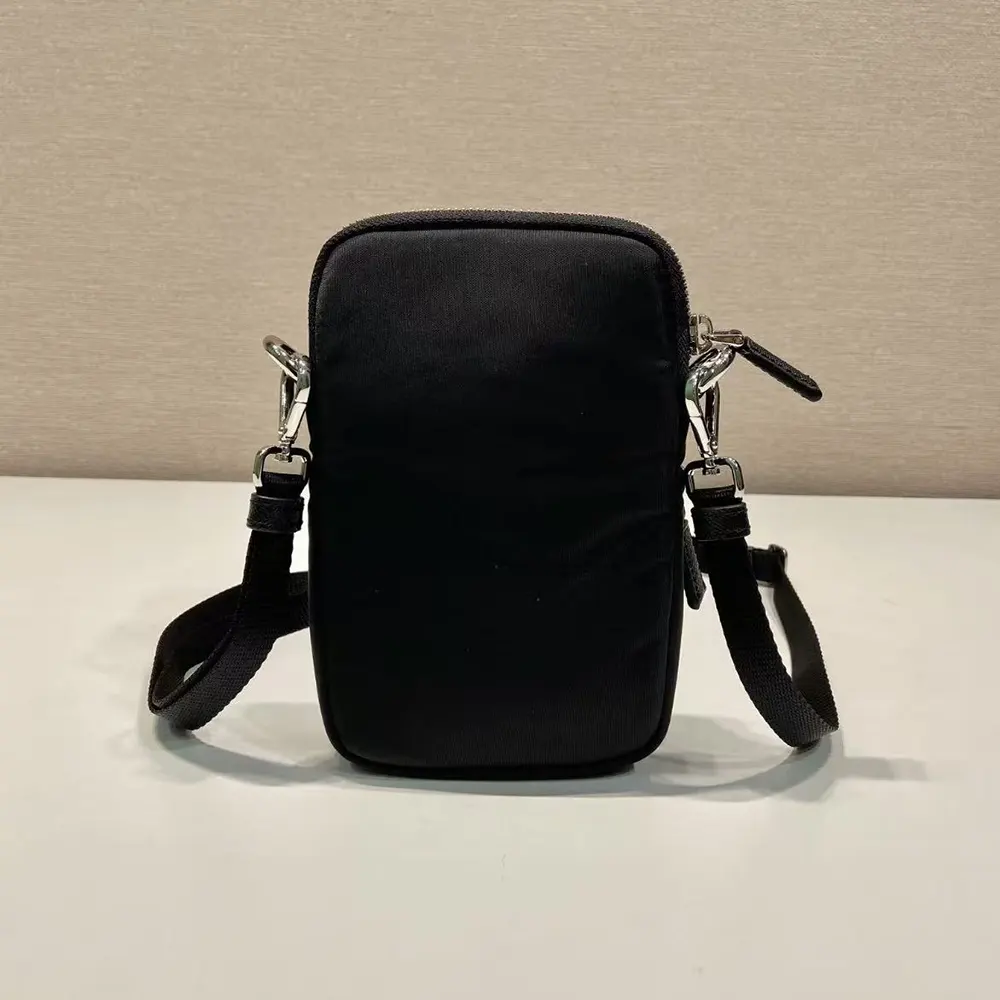 Side angle showing slim profile of Prada Men Nylon Logo Smartphone Case-Black