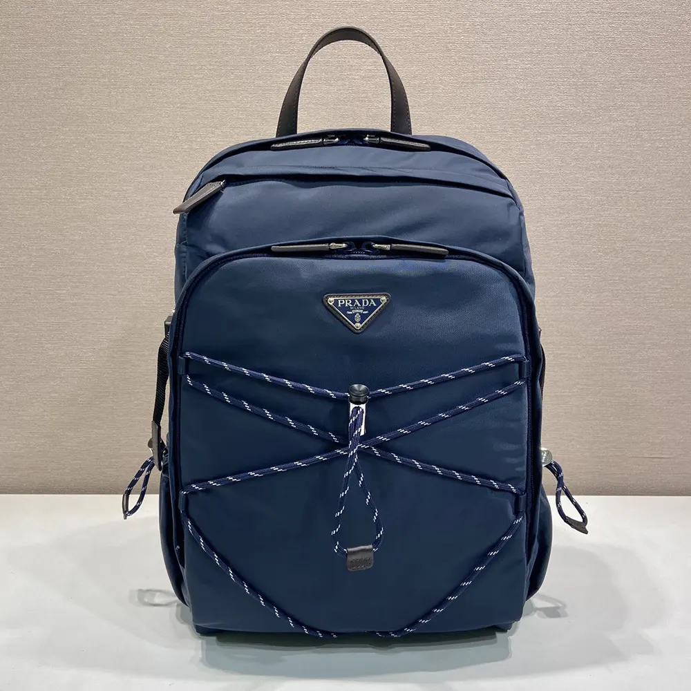 Close-up of leather accents and silver hardware on Prada Speedrock backpack
