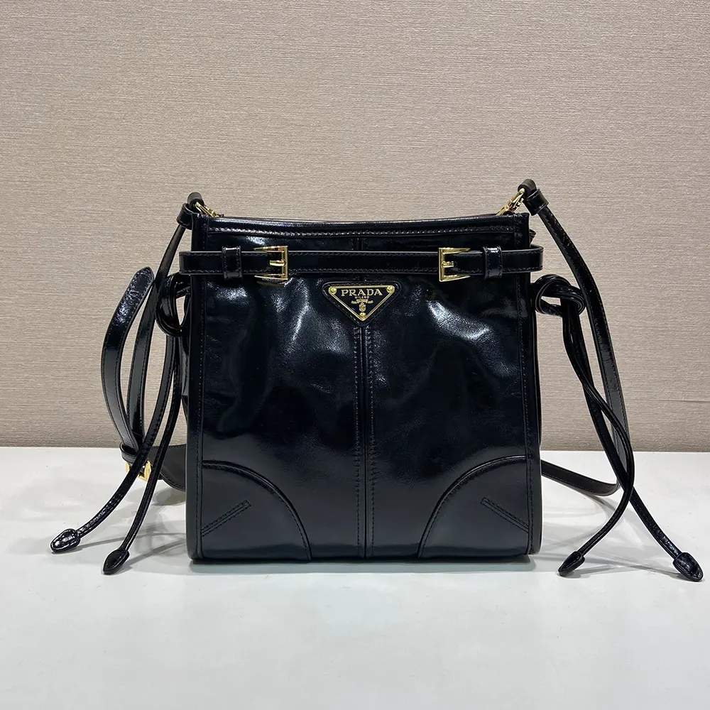 Close-up of Prada triangle logo on Bonnie Leather Mini Shoulder Bag