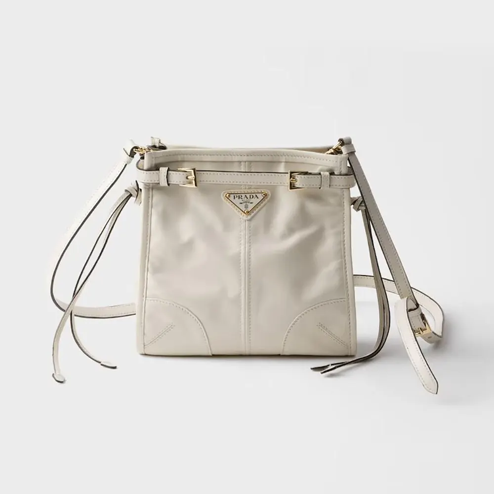 Front angle of Prada Women Bonnie Leather Mini Shoulder Bag-White showing flap