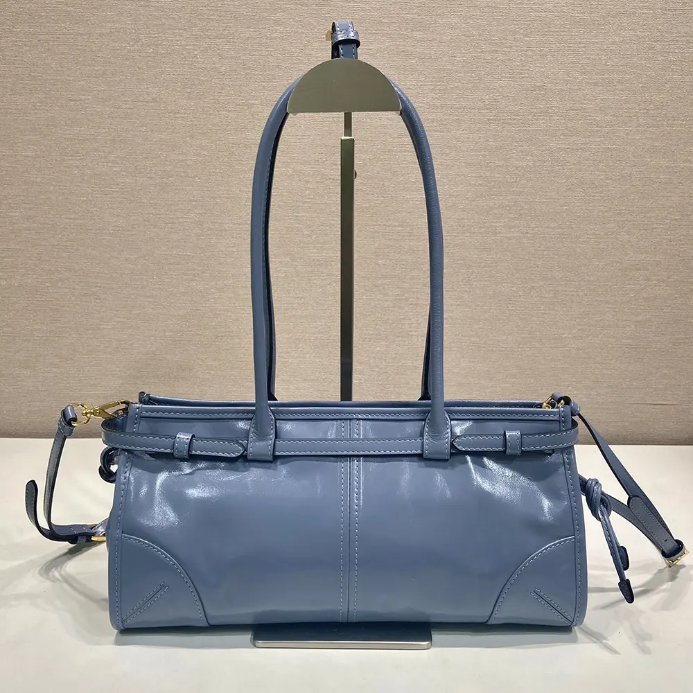 Side angle showing silhouette of Prada Women Bonnie Medium Leather Handbag-Light Blue