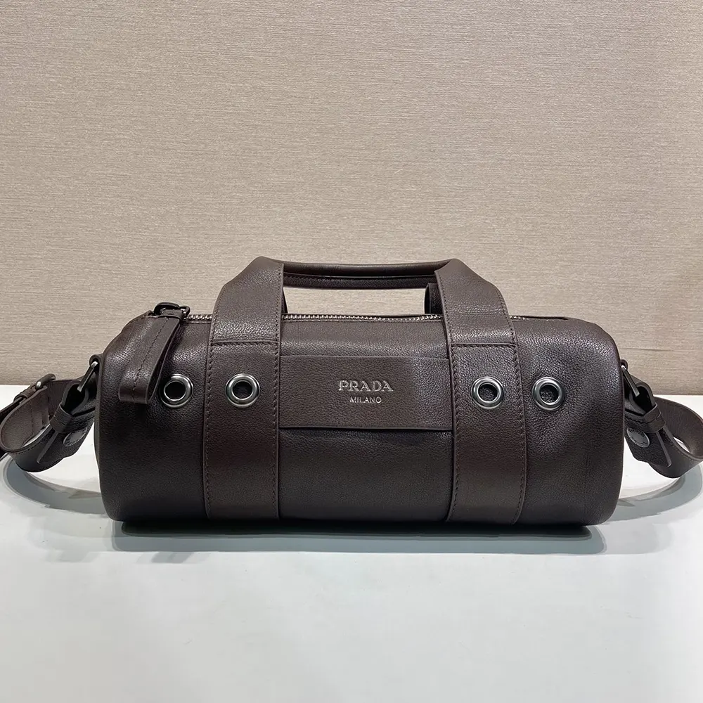 Close-up on matte gold hardware of Prada Women Route Large Leather Top-Handle Bag