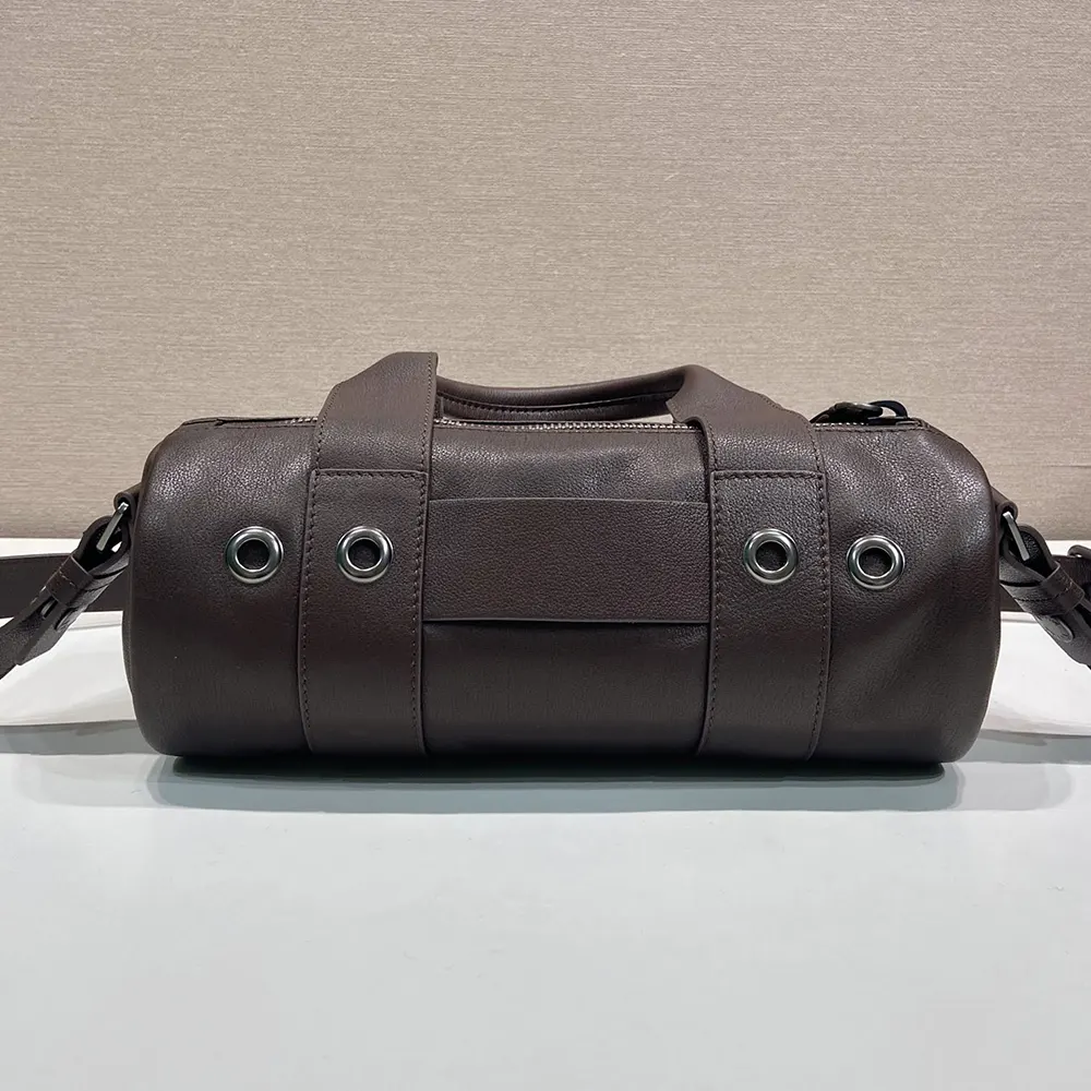 Side angle showing structured silhouette of Prada Women Route Large Leather Top-Handle Bag