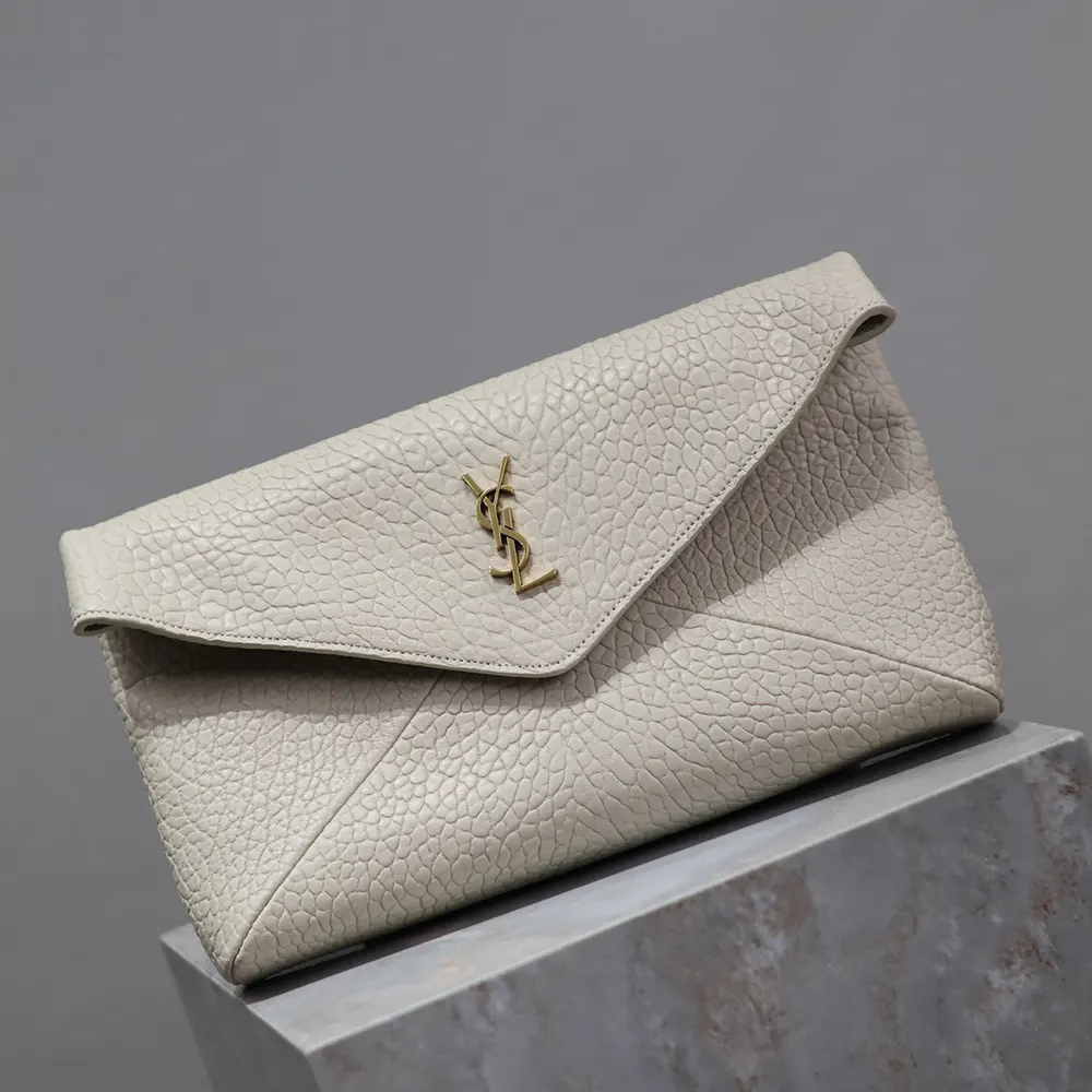 Side angle showing slim profile of Saint Laurent YSL Cassandre pouch white